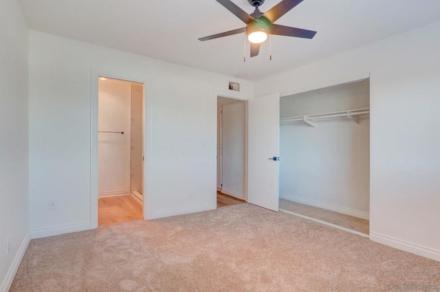 unfurnished bedroom with a closet, ceiling fan, and light colored carpet