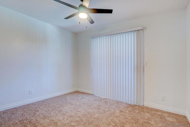 empty room with carpet and ceiling fan