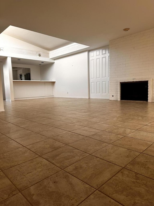 unfurnished living room featuring tile patterned flooring and a fireplace