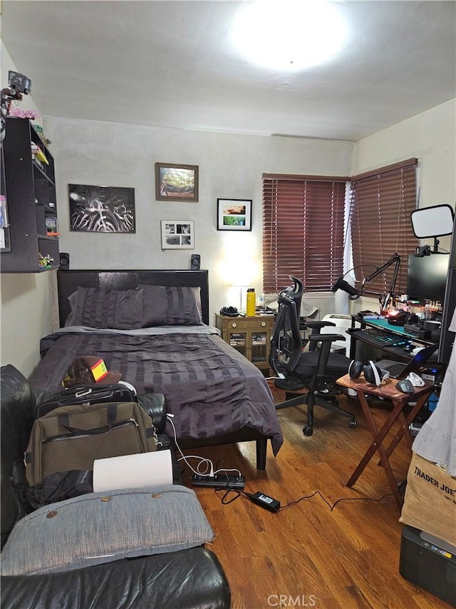 bedroom featuring hardwood / wood-style floors