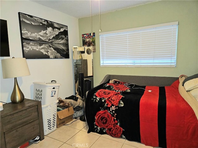 bedroom with light tile patterned floors