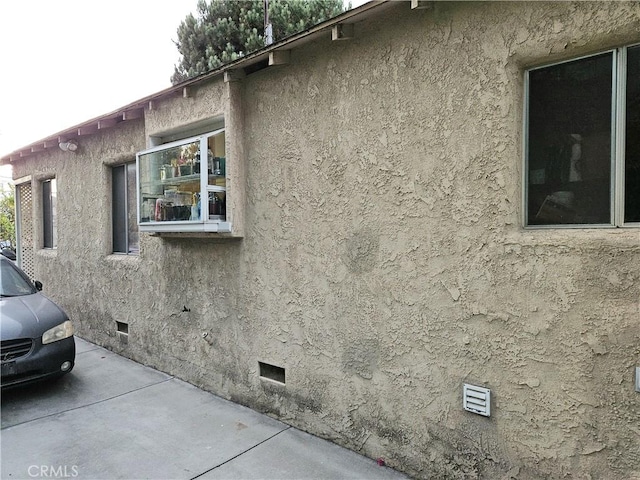 view of home's exterior with a patio