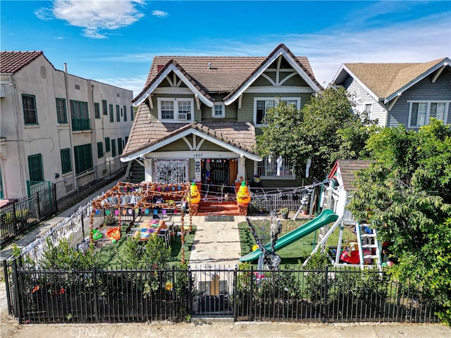 view of front of home featuring a playground