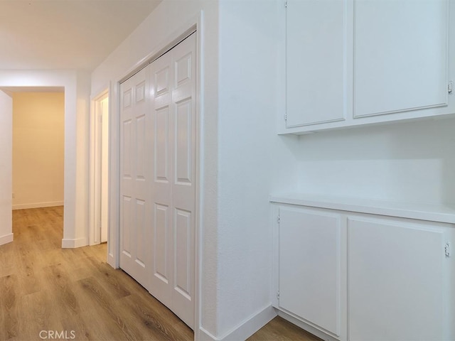 hallway featuring light hardwood / wood-style floors