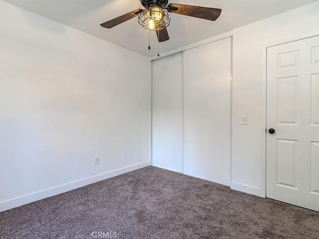 unfurnished bedroom with carpet floors, a closet, and ceiling fan