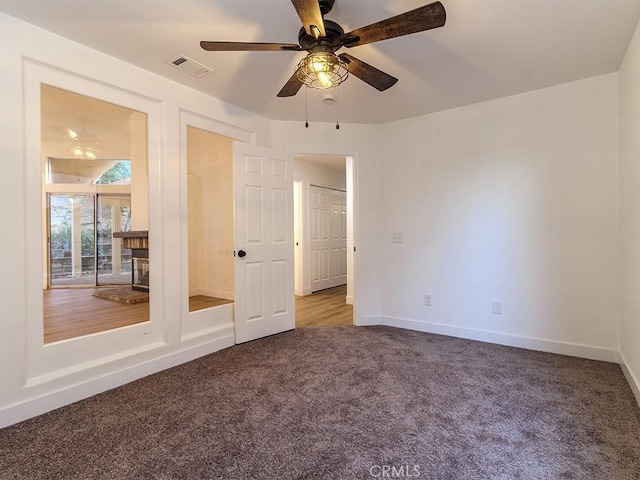 unfurnished bedroom with carpet and ceiling fan