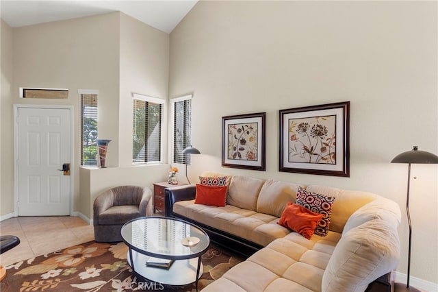 tiled living room with high vaulted ceiling