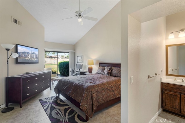 bedroom with access to outside, ceiling fan, sink, and light tile patterned flooring