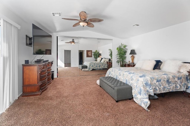 bedroom featuring carpet, a closet, vaulted ceiling, and ceiling fan