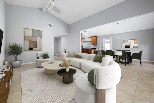 tiled living room with lofted ceiling with beams