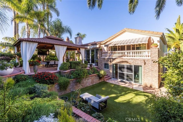 rear view of property featuring a yard