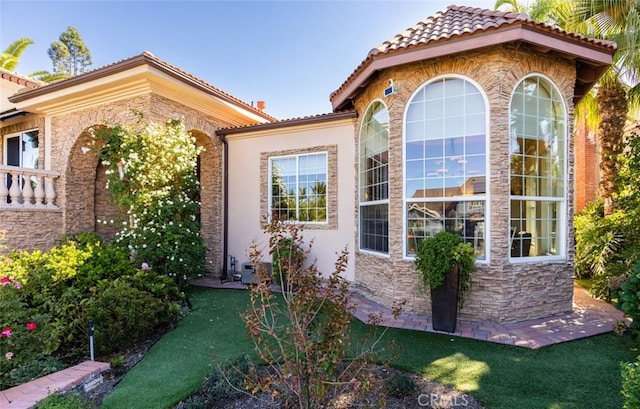 view of property exterior featuring a yard