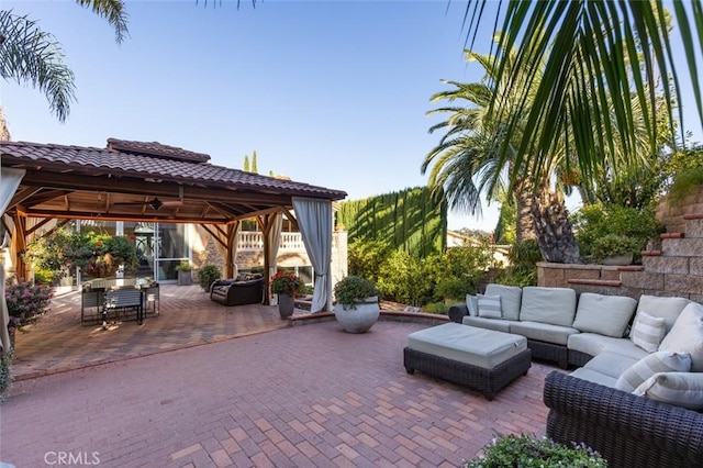 view of patio / terrace featuring an outdoor living space and a gazebo