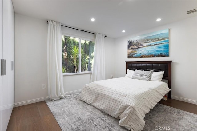 bedroom featuring dark wood-type flooring