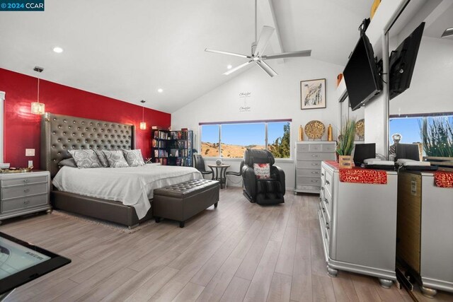 bedroom featuring vaulted ceiling, ceiling fan, and light hardwood / wood-style floors