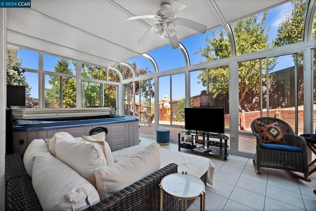 sunroom featuring ceiling fan