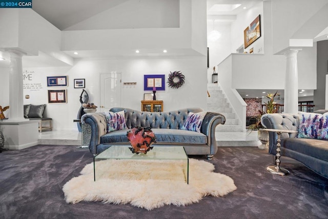 living room with high vaulted ceiling and carpet flooring