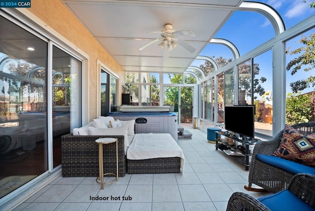 sunroom featuring ceiling fan