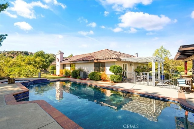 view of swimming pool with cooling unit, a patio area, a pergola, and a jacuzzi