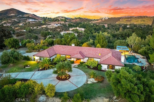 aerial view at dusk with a mountain view