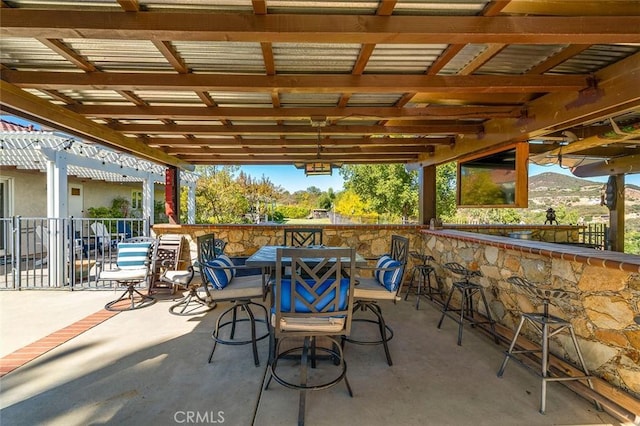 view of patio featuring a pergola and a mountain view