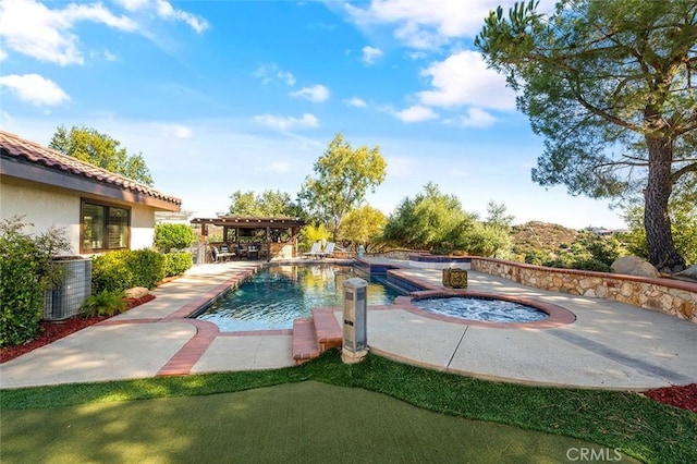 view of pool featuring central AC, an in ground hot tub, and a patio