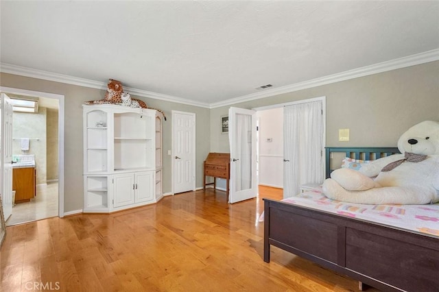 bedroom featuring wood-type flooring and ornamental molding