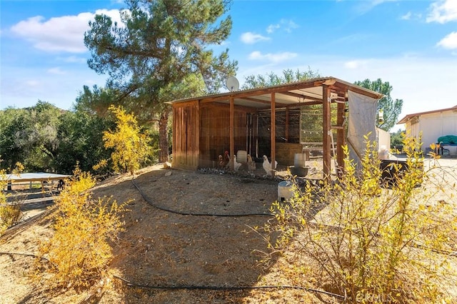 view of patio featuring an outbuilding