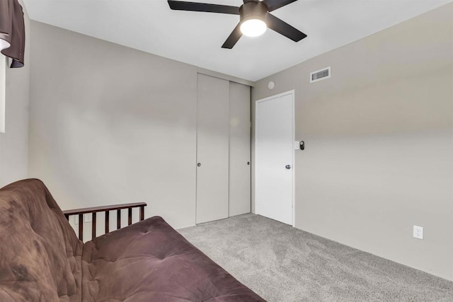 sitting room with light carpet and ceiling fan