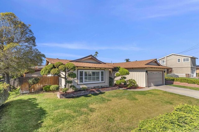 ranch-style home with a front yard and a garage