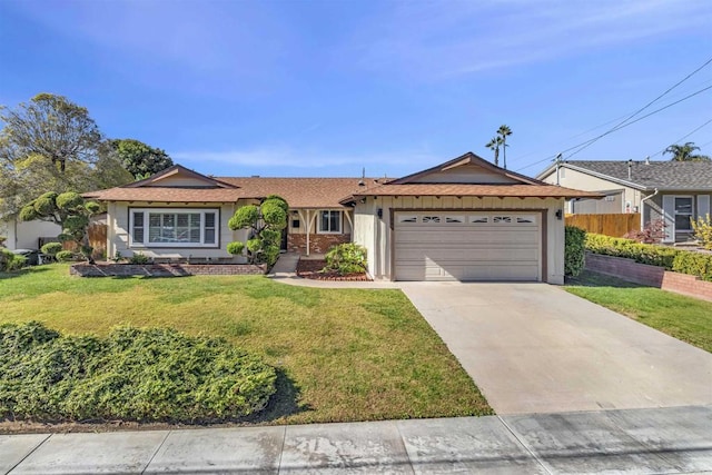 single story home with a garage and a front lawn