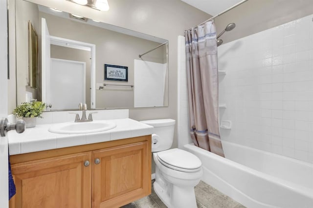 full bathroom featuring shower / tub combo, vanity, and toilet