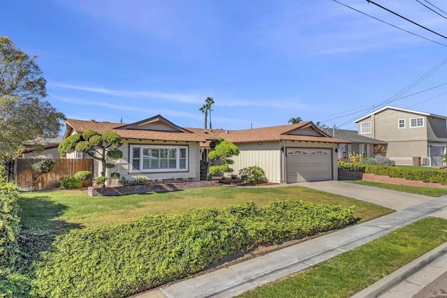 ranch-style house featuring a garage and a front lawn