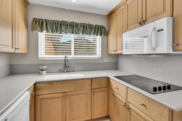 kitchen featuring decorative backsplash, light brown cabinetry, white appliances, and sink