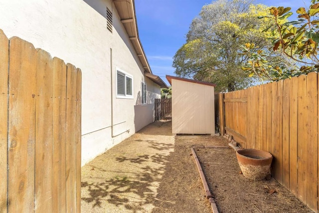 view of side of property featuring a shed