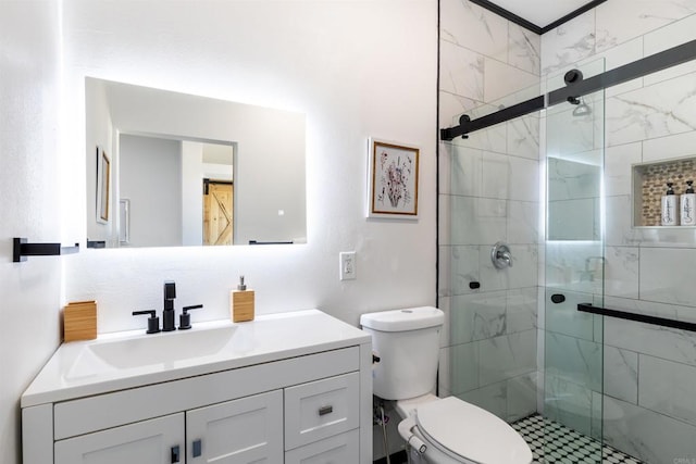 bathroom with vanity, toilet, and an enclosed shower