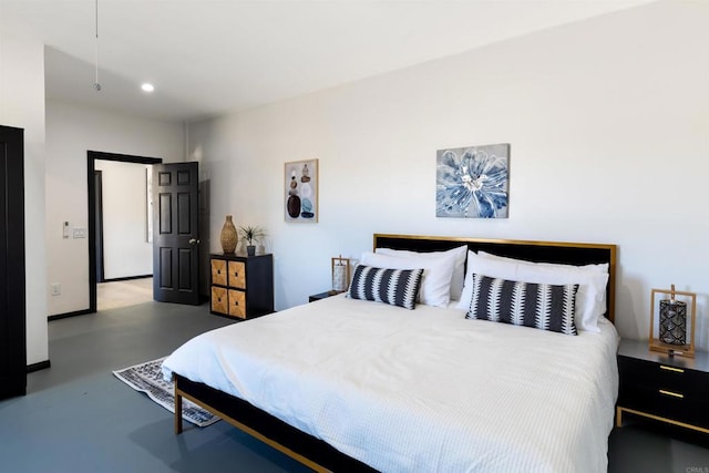 bedroom featuring concrete flooring