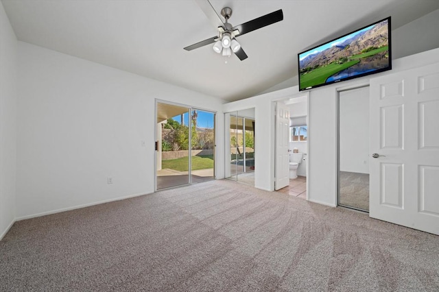 unfurnished bedroom with ensuite bathroom, access to outside, light colored carpet, ceiling fan, and lofted ceiling