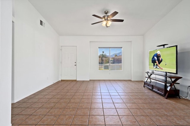 tiled foyer featuring ceiling fan