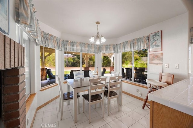 sunroom / solarium featuring an inviting chandelier