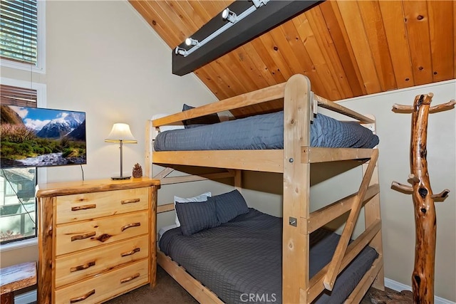 bedroom with wood ceiling and vaulted ceiling