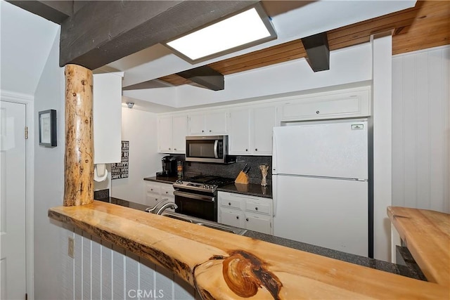 kitchen with white cabinets, sink, appliances with stainless steel finishes, and tasteful backsplash