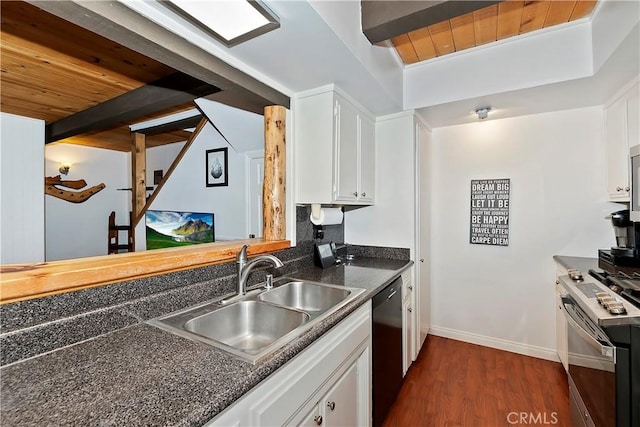 kitchen featuring white cabinets, gas stove, and sink