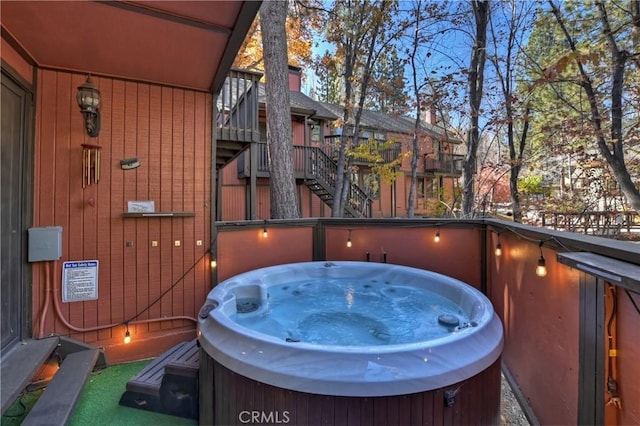 exterior space with a hot tub