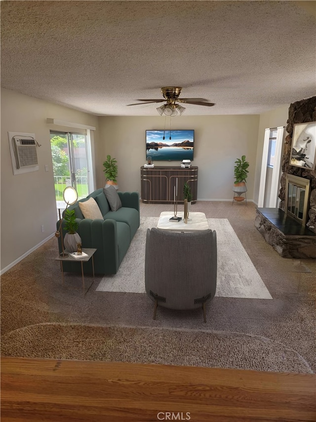 living room featuring ceiling fan, a fireplace, a textured ceiling, carpet floors, and a wall unit AC