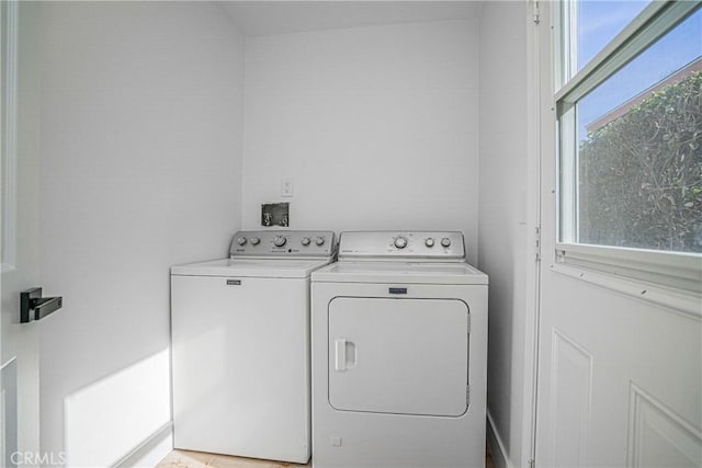 laundry room with independent washer and dryer