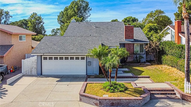 view of front of house with a front yard and a garage