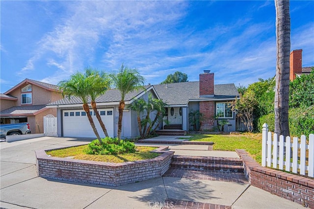 view of front of house with a front lawn and a garage