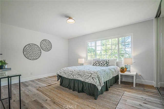 bedroom with light wood-type flooring