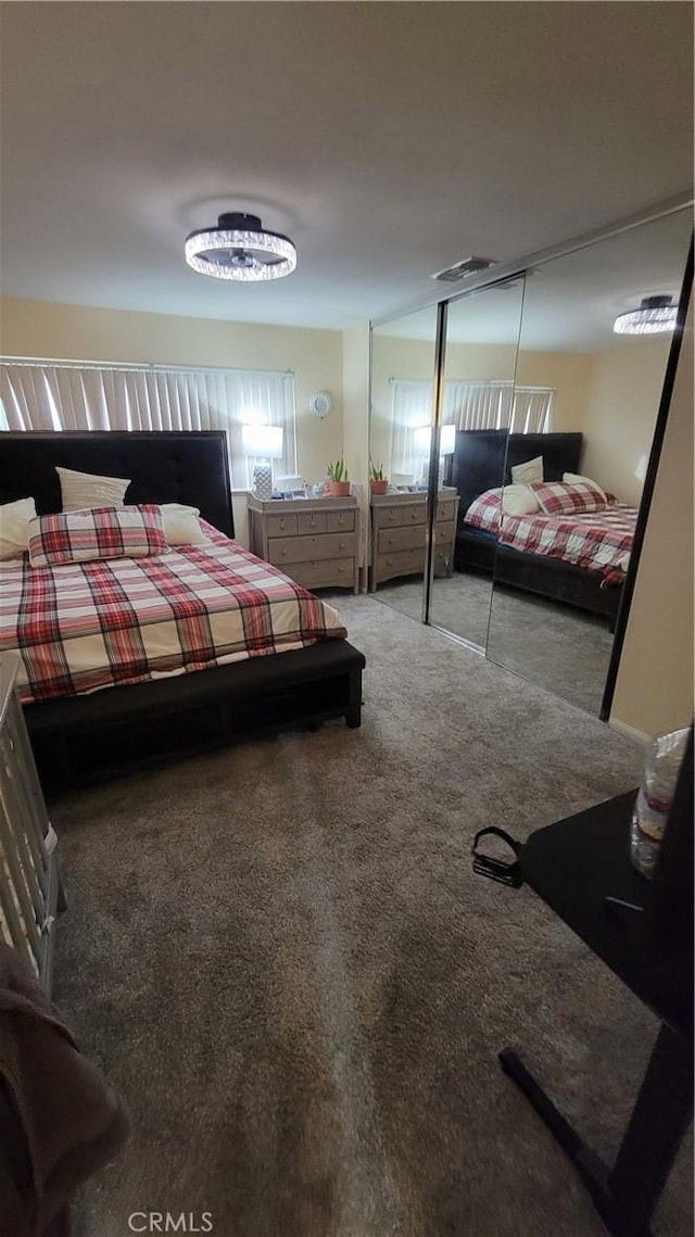 carpeted bedroom featuring a closet